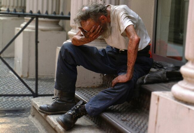 man sitting on step in despair