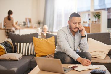 man on phone working from home